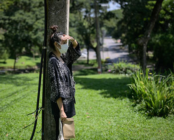 Series photo of young women waiting something in a public park