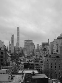 High angle view of buildings in city against sky