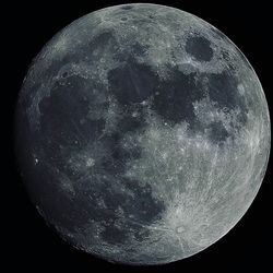 Low angle view of moon in the dark