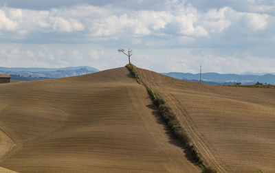 Scenic view of land against sky