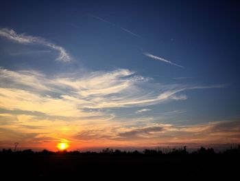 Silhouette landscape against sky during sunset