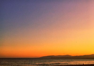 Scenic view of sea against sky at sunset