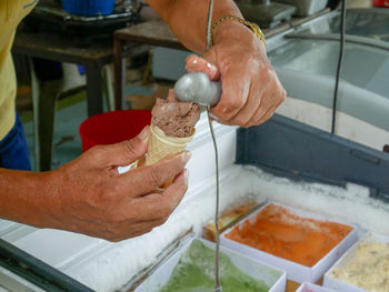 Midsection of man preparing food