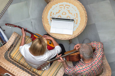 High angle view of people sitting on stage