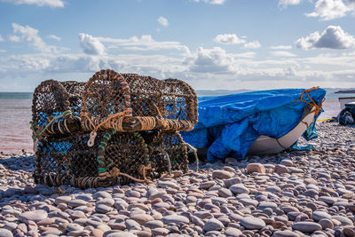 Panoramic view of rocks on beach against sky