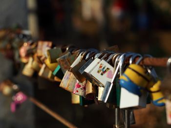 Close-up of padlocks on railing