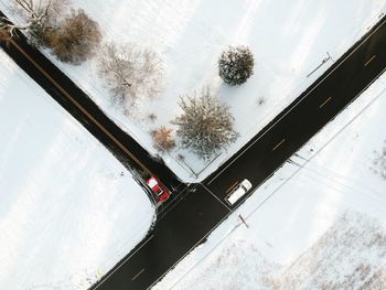 High angle view of car window on snow covered landscape