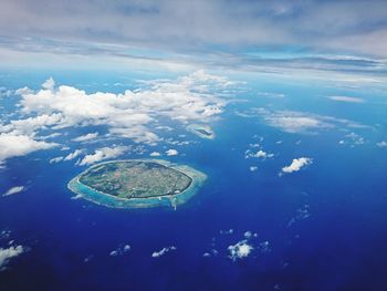 Aerial view of island and sea against sky