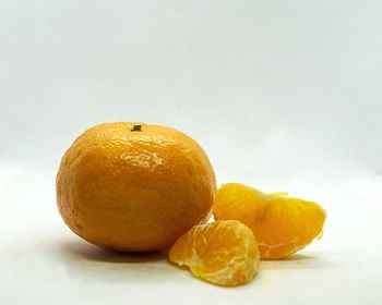 Close-up of oranges against white background