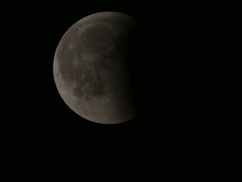 Low angle view of moon against sky at night