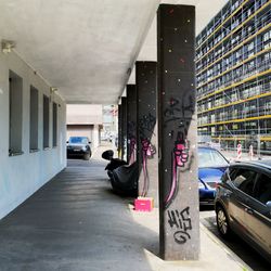 Cars on street amidst buildings in city