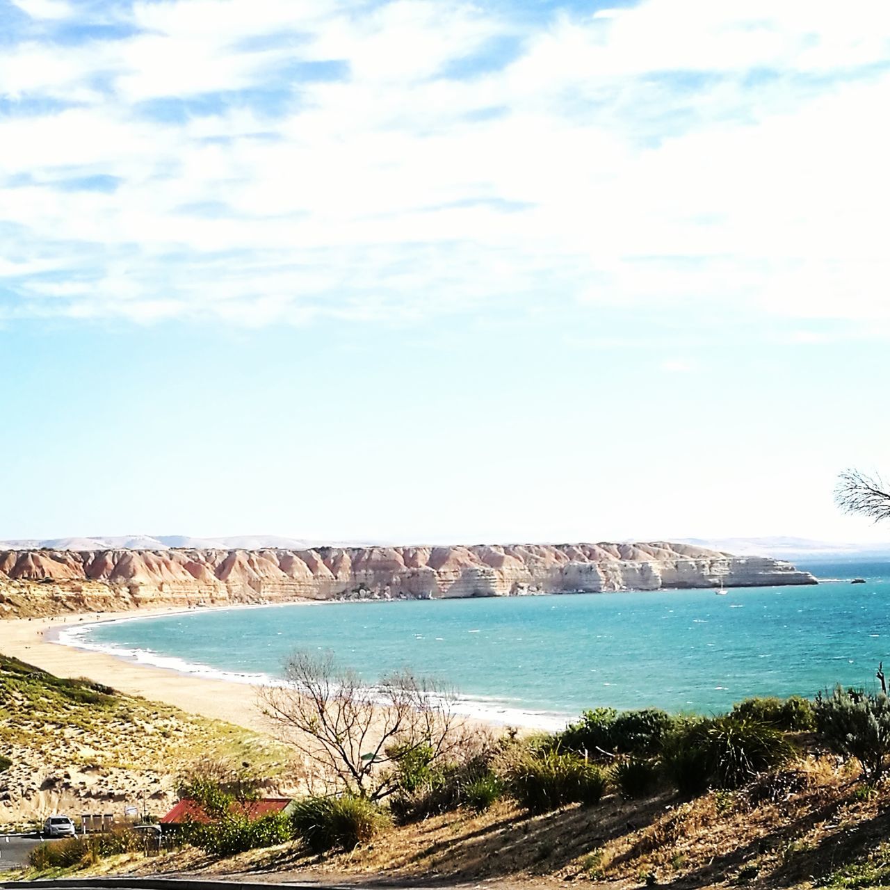 PANORAMIC VIEW OF BEACH AGAINST SKY