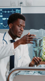 Doctor holding medical xray in clinic