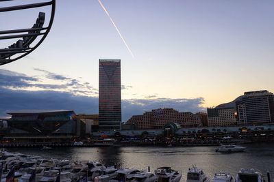 City by river against sky