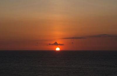 Scenic view of sea against romantic sky at sunset