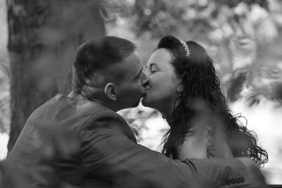 Side view of mother and daughter outdoors