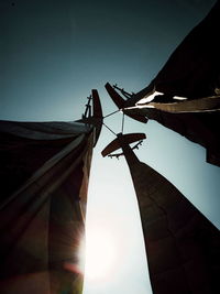 Low angle view of silhouette building against clear sky