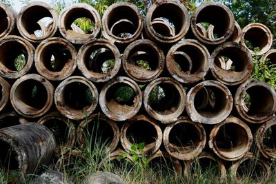 Stack of firewood on field