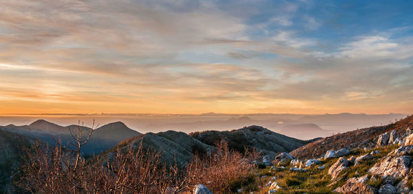 Scenic view of mountains against sky during sunset