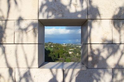 Window looking at a scenic valley