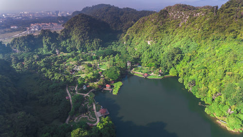 High angle view of plants by river against mountains