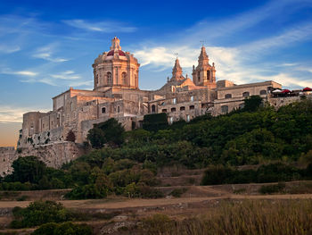 View of historical building against cloudy sky