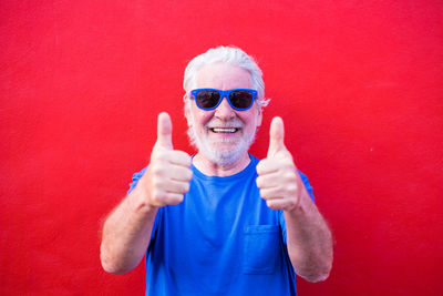 Portrait of a smiling man with red face