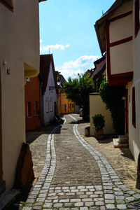 Footpath amidst buildings in town