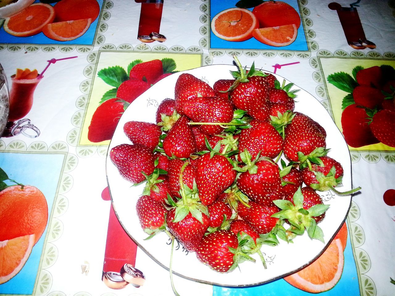 red, food and drink, food, fruit, freshness, healthy eating, strawberry, indoors, still life, table, close-up, wall - building feature, no people, ripe, day, high angle view, variation, directly above, abundance, large group of objects