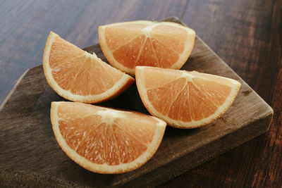 Close-up of orange slices on table