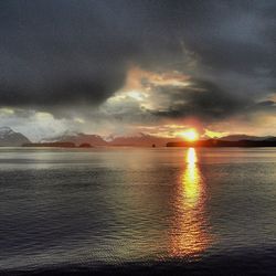 Scenic view of sea against cloudy sky