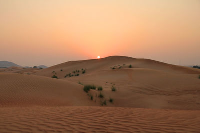 Scenic view of desert against clear sky