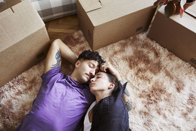 Young couple lying down together