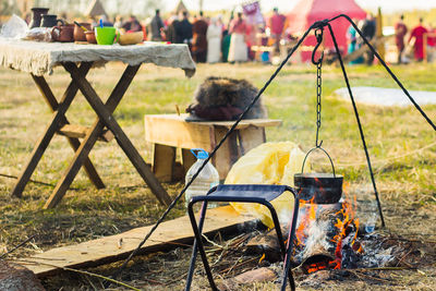 Camping outdoors - tents, equipment and cooking. cooking at a camping site in nature.