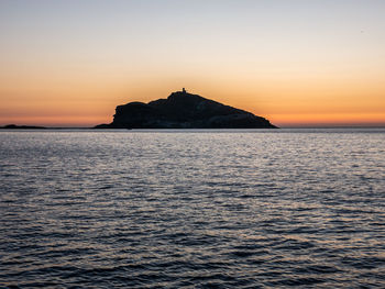 Scenic view of sea against sky during sunset