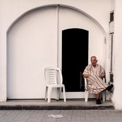 Portrait of man sitting on seat