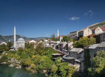 Buildings in city against sky