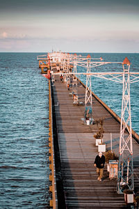 Pier over sea against sky