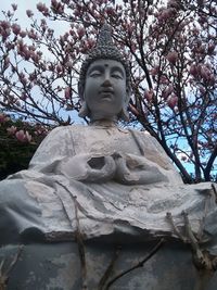 Low angle view of buddha statue