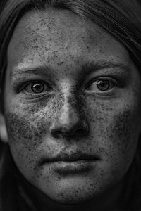 Close-up portrait of teenage girl with freckles