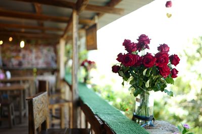 Close-up of rose vase on table