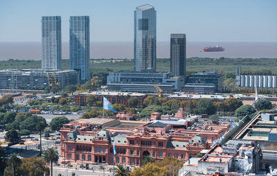 High angle view of buildings in city against sky