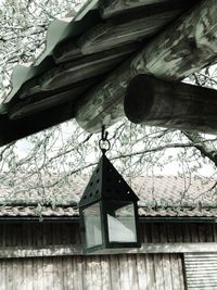 Low angle view of birdhouse on tree against sky