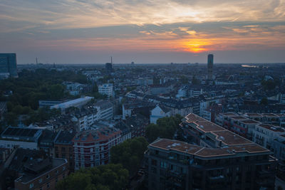 High angle view of buildings in dusseldorf, germany against sky during sunset