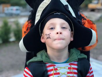 Portrait of cute boy wearing pirate costume