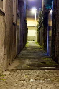 Illuminated walkway at night