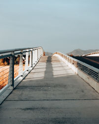 Surface level of bridge against clear sky