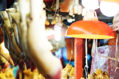 Close-up of lanterns hanging in store