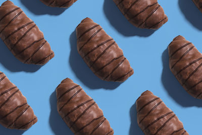 High angle view of chocolate on table against blue background