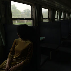 Woman sitting in bus